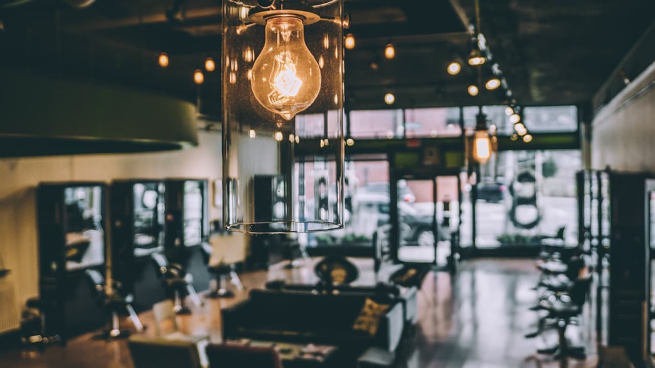 Barbershop interior with chairs and hanging bulbs