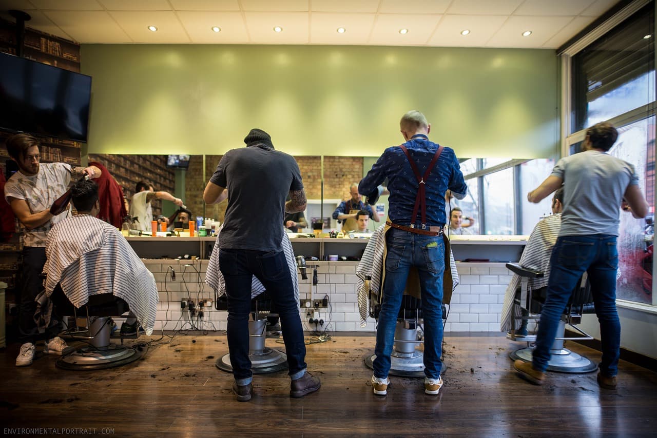 Barbers at work in a busy shop